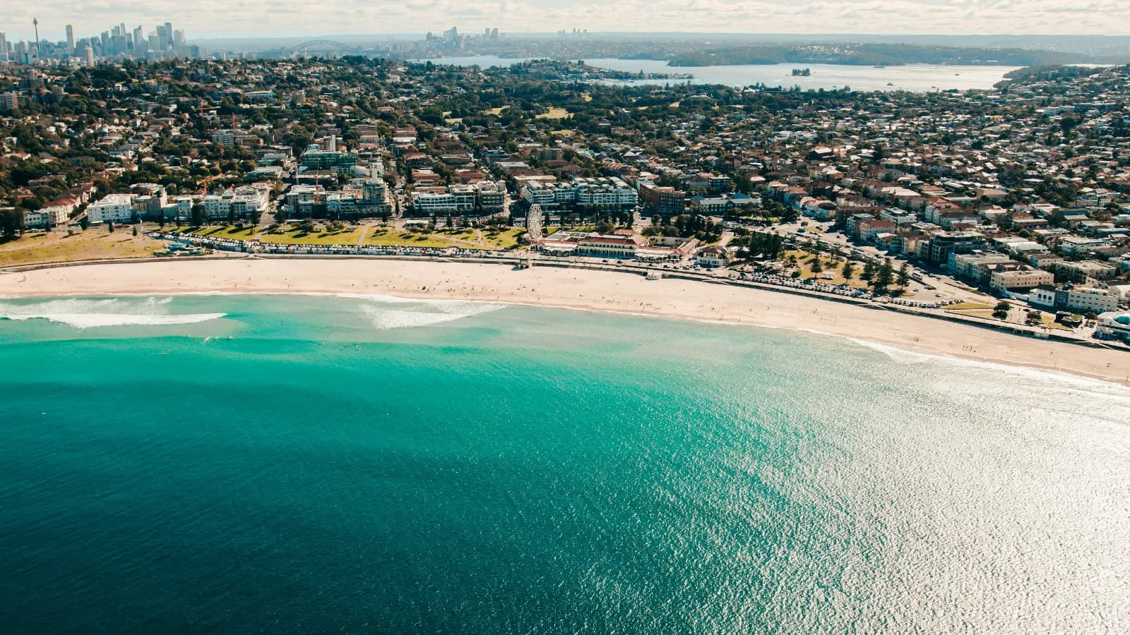 Aerial view of Bondi Beach, the eastern suburbs and the distant Sydney skyline