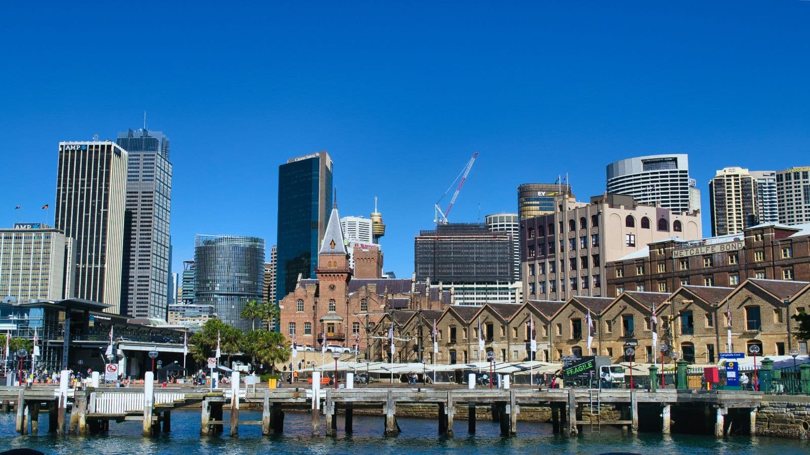 The Rocks waterfront with heritage buildings and the Sydney skyline